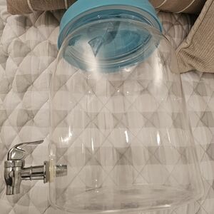 Clear Beverage Dispenser with Blue Lid and Silver Spout Faucet